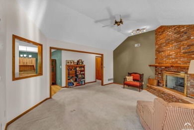 Unique open floor plan.  Living room featuring a vaulted ceiling on Alvamar Country Club in Kansas - for sale on GolfHomes.com, golf home, golf lot