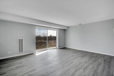 This beautifully updated 2-bed, 2-bath END-UNIT condo offers on Twin Lakes Golf Course in Illinois - for sale on GolfHomes.com, golf home, golf lot