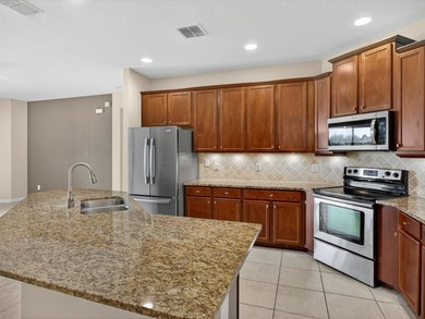 Waterfront home in Shingle Creek Reserve, where Florida living on Oaks National Golf Course in Florida - for sale on GolfHomes.com, golf home, golf lot