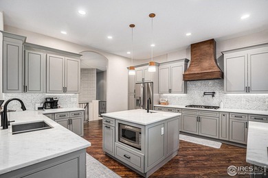 Discover quiet luxury in this exceptional ranch home, situated on Colorado National Golf Club in Colorado - for sale on GolfHomes.com, golf home, golf lot