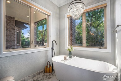 Discover quiet luxury in this exceptional ranch home, situated on Colorado National Golf Club in Colorado - for sale on GolfHomes.com, golf home, golf lot