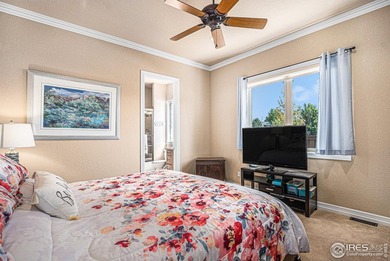 Discover quiet luxury in this exceptional ranch home, situated on Colorado National Golf Club in Colorado - for sale on GolfHomes.com, golf home, golf lot