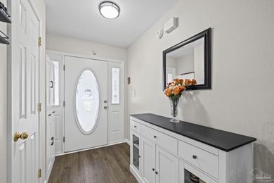 Welcome home to this beautifully updated Gulf Breeze gem, tucked on Tiger Point Golf and Country Club in Florida - for sale on GolfHomes.com, golf home, golf lot