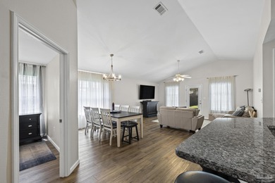 Welcome home to this beautifully updated Gulf Breeze gem, tucked on Tiger Point Golf and Country Club in Florida - for sale on GolfHomes.com, golf home, golf lot