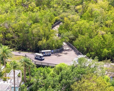 Interlachen is a spacious, meticulously maintained neighborhood on Club at Pelican Bay Golf Course in Florida - for sale on GolfHomes.com, golf home, golf lot