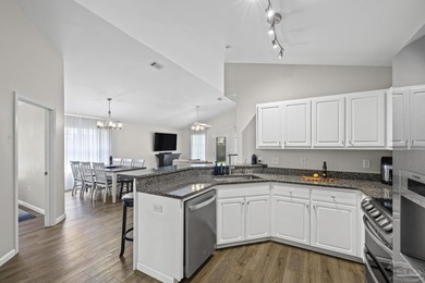 Welcome home to this beautifully updated Gulf Breeze gem, tucked on Tiger Point Golf and Country Club in Florida - for sale on GolfHomes.com, golf home, golf lot