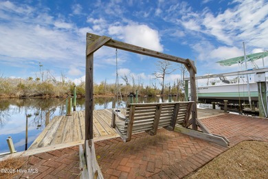 Waterfront living at its finest! This beautiful home offers on River Bend Golf and Country Club in North Carolina - for sale on GolfHomes.com, golf home, golf lot