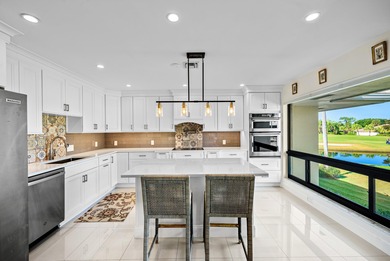 Beautifully reimagined 2-bedroom plus den residence, ideally on Quail Ridge Golf Course and Country Club in Florida - for sale on GolfHomes.com, golf home, golf lot