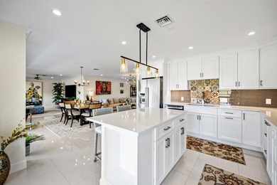 Beautifully reimagined 2-bedroom plus den residence, ideally on Quail Ridge Golf Course and Country Club in Florida - for sale on GolfHomes.com, golf home, golf lot