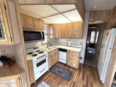 Welcome home to this great park model in desirable Juniper Ridge on Juniper Ridge R.V. Golf Resort in Arizona - for sale on GolfHomes.com, golf home, golf lot