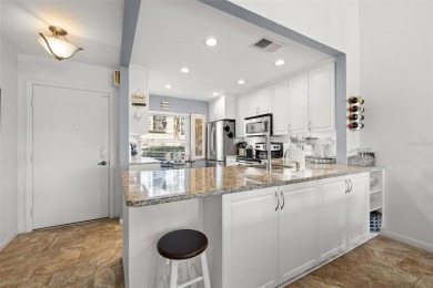 EXCEPTIONAL VALUE for this SPECTACULAR GOLF COURSE TOWNHOME IN on Isla Del Sol Yacht and Country Club in Florida - for sale on GolfHomes.com, golf home, golf lot