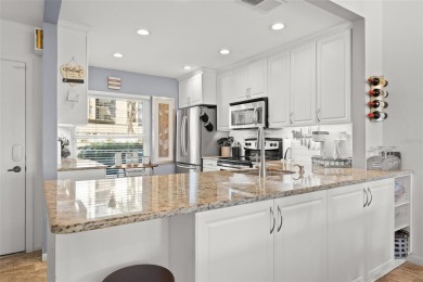 EXCEPTIONAL VALUE for this SPECTACULAR GOLF COURSE TOWNHOME IN on Isla Del Sol Yacht and Country Club in Florida - for sale on GolfHomes.com, golf home, golf lot