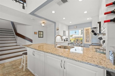 EXCEPTIONAL VALUE for this SPECTACULAR GOLF COURSE TOWNHOME IN on Isla Del Sol Yacht and Country Club in Florida - for sale on GolfHomes.com, golf home, golf lot