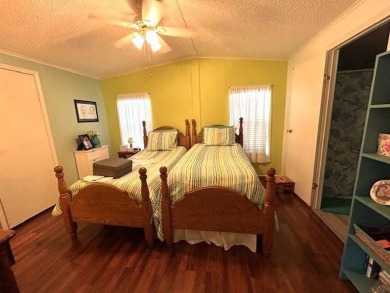 This charming cottage-style home radiates the essence of a sunny on Crystal Lake Club in Florida - for sale on GolfHomes.com, golf home, golf lot