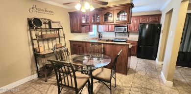 This precious 4 bedroom 2 bath home is in a great location on Pascagoula Country Club in Mississippi - for sale on GolfHomes.com, golf home, golf lot