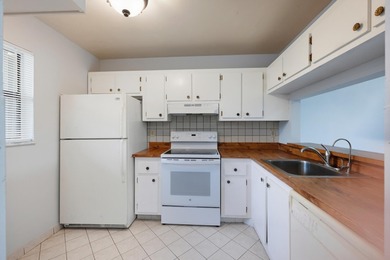 Welcome to 7142 Golf Colony Ct #102 located in Lucerne Lakes on Forest Oaks Golf Club in Florida - for sale on GolfHomes.com, golf home, golf lot