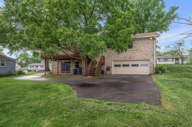 Welcome to this stunning brick ranch perfectly positioned on on Tates Creek Golf Course in Kentucky - for sale on GolfHomes.com, golf home, golf lot