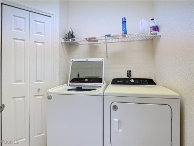 This pristine Ibis II model in HERONS GLEN COUNTRY CLUB sits in on Herons Glen Golf and Country Club in Florida - for sale on GolfHomes.com, golf home, golf lot