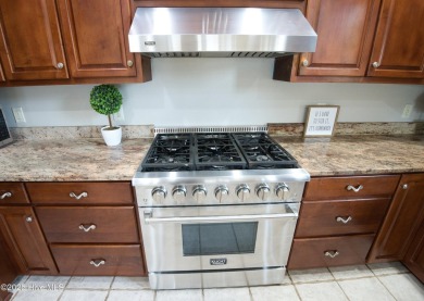 Welcome to this exceptional custom-built home in the prestigious on Ocean Ridge Plantation in North Carolina - for sale on GolfHomes.com, golf home, golf lot