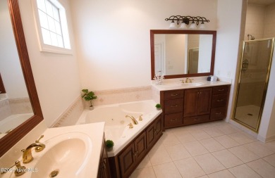 Welcome to this exceptional custom-built home in the prestigious on Ocean Ridge Plantation in North Carolina - for sale on GolfHomes.com, golf home, golf lot