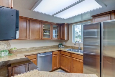 Experience refined living in this exquisite top-floor end unit on El Dorado Park Golf Course in California - for sale on GolfHomes.com, golf home, golf lot