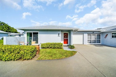 Beautifully renovated and spacious villa in Palm Harbor's on Highland Lakes Executive Golf Course in Florida - for sale on GolfHomes.com, golf home, golf lot