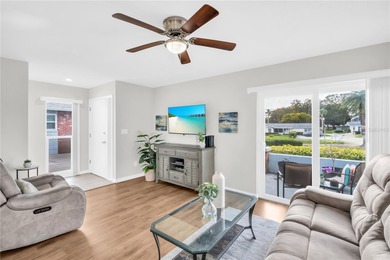 Beautifully renovated and spacious villa in Palm Harbor's on Highland Lakes Executive Golf Course in Florida - for sale on GolfHomes.com, golf home, golf lot