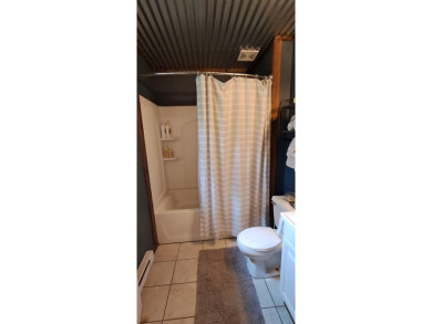 Welcome to this charming 2-bedroom, 1-bath getaway, perfectly on The Loon Golf Resort in Michigan - for sale on GolfHomes.com, golf home, golf lot