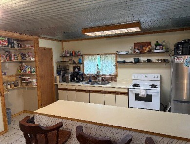 Welcome to this charming 2-bedroom, 1-bath getaway, perfectly on The Loon Golf Resort in Michigan - for sale on GolfHomes.com, golf home, golf lot