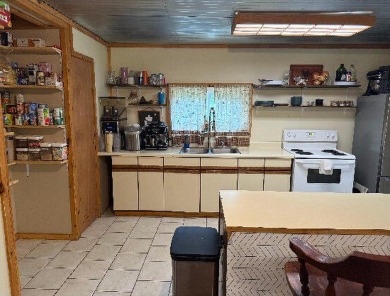 Welcome to this charming 2-bedroom, 1-bath getaway, perfectly on The Loon Golf Resort in Michigan - for sale on GolfHomes.com, golf home, golf lot