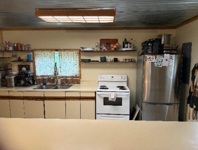 Welcome to this charming 2-bedroom, 1-bath getaway, perfectly on The Loon Golf Resort in Michigan - for sale on GolfHomes.com, golf home, golf lot