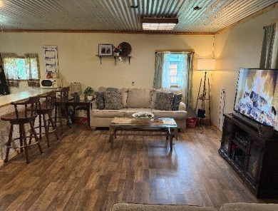 Welcome to this charming 2-bedroom, 1-bath getaway, perfectly on The Loon Golf Resort in Michigan - for sale on GolfHomes.com, golf home, golf lot
