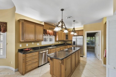 RARE AND DESIRABLE HANGAR HOME OFFERING IN THE EXCLUSIVE SPRUCE on Spruce Creek Golf Club in Florida - for sale on GolfHomes.com, golf home, golf lot