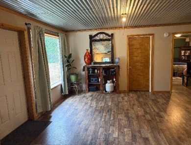 Welcome to this charming 2-bedroom, 1-bath getaway, perfectly on The Loon Golf Resort in Michigan - for sale on GolfHomes.com, golf home, golf lot