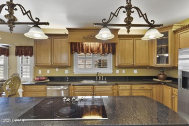 RARE AND DESIRABLE HANGAR HOME OFFERING IN THE EXCLUSIVE SPRUCE on Spruce Creek Golf Club in Florida - for sale on GolfHomes.com, golf home, golf lot