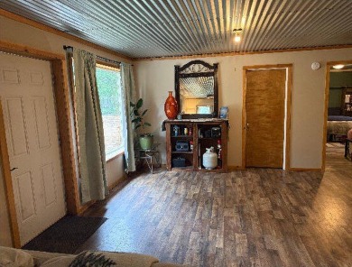 Welcome to this charming 2-bedroom, 1-bath getaway, perfectly on The Loon Golf Resort in Michigan - for sale on GolfHomes.com, golf home, golf lot