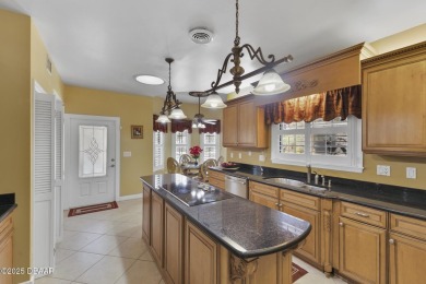 RARE AND DESIRABLE HANGAR HOME OFFERING IN THE EXCLUSIVE SPRUCE on Spruce Creek Golf Club in Florida - for sale on GolfHomes.com, golf home, golf lot