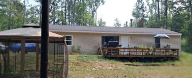 Welcome to this charming 2-bedroom, 1-bath getaway, perfectly on The Loon Golf Resort in Michigan - for sale on GolfHomes.com, golf home, golf lot