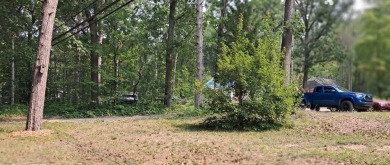 Welcome to this charming 2-bedroom, 1-bath getaway, perfectly on The Loon Golf Resort in Michigan - for sale on GolfHomes.com, golf home, golf lot