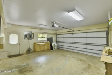 RARE AND DESIRABLE HANGAR HOME OFFERING IN THE EXCLUSIVE SPRUCE on Spruce Creek Golf Club in Florida - for sale on GolfHomes.com, golf home, golf lot
