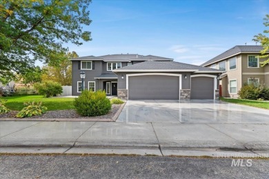 A covered entrance and dramatic vaulted foyer with natural light on Boise Ranch Golf Course, Inc. in Idaho - for sale on GolfHomes.com, golf home, golf lot