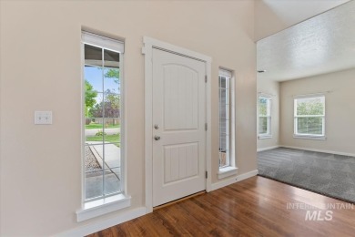 A covered entrance and dramatic vaulted foyer with natural light on Boise Ranch Golf Course, Inc. in Idaho - for sale on GolfHomes.com, golf home, golf lot