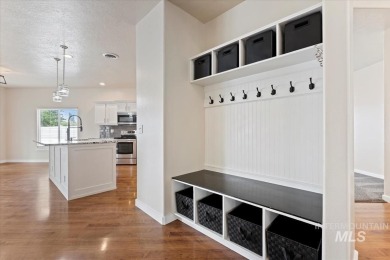 A covered entrance and dramatic vaulted foyer with natural light on Boise Ranch Golf Course, Inc. in Idaho - for sale on GolfHomes.com, golf home, golf lot