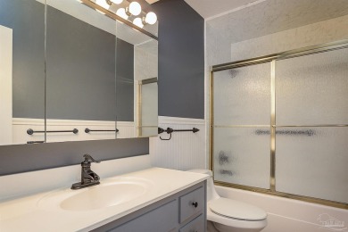 Tucked away in one of Gulf Breeze's most desirable waterfront on Tiger Point Golf and Country Club in Florida - for sale on GolfHomes.com, golf home, golf lot
