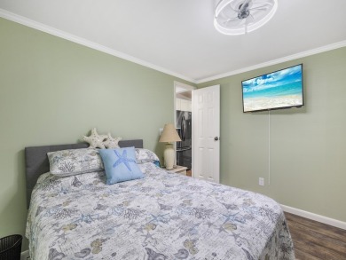 Meticulously maintained, move-in ready home with all the on Barefoot Bay Golf Course in Florida - for sale on GolfHomes.com, golf home, golf lot