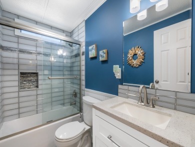 Meticulously maintained, move-in ready home with all the on Barefoot Bay Golf Course in Florida - for sale on GolfHomes.com, golf home, golf lot