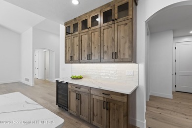 Immerse yourself in the best of Teton Valley living with this on Teton Reserve in Idaho - for sale on GolfHomes.com, golf home, golf lot