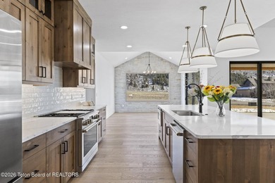 Immerse yourself in the best of Teton Valley living with this on Teton Reserve in Idaho - for sale on GolfHomes.com, golf home, golf lot