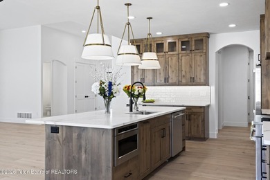 Immerse yourself in the best of Teton Valley living with this on Teton Reserve in Idaho - for sale on GolfHomes.com, golf home, golf lot