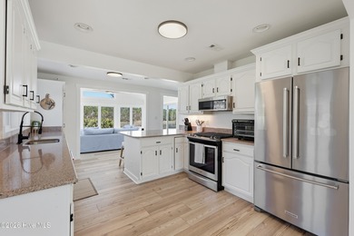 Tucked along a peaceful deep-water canal in the sought-after on Olde Point Golf and Country Club in North Carolina - for sale on GolfHomes.com, golf home, golf lot